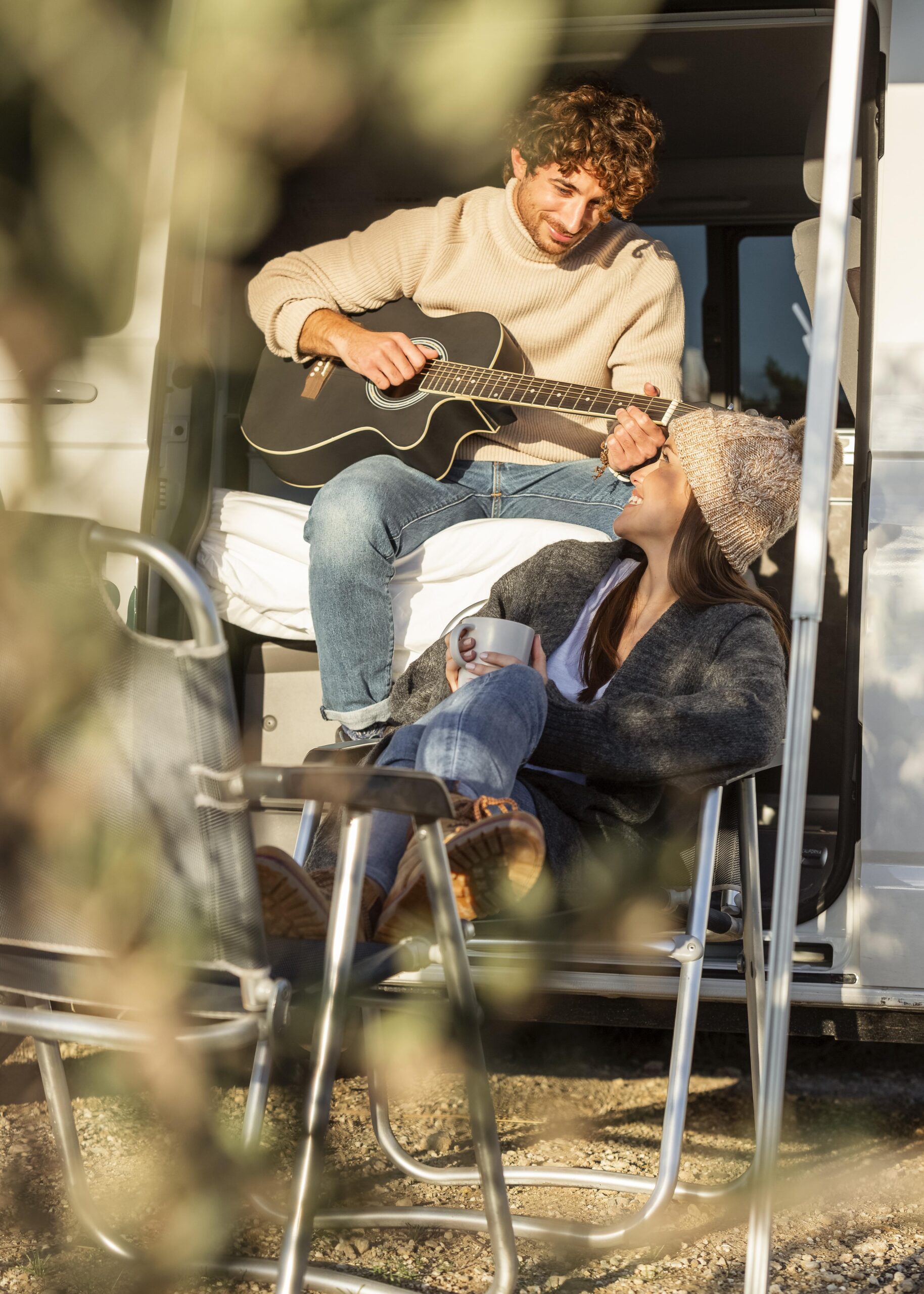 couple-relaxing-playing-guitar-car-while-road-trip